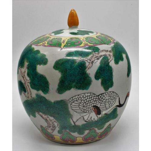 Chinese Famille Rose jar and cover decorated with storks amongst pine trees