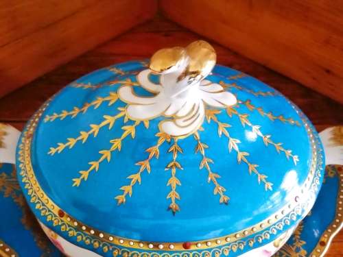 Sevres-style two-handled tureen and stand decorated with cherubs