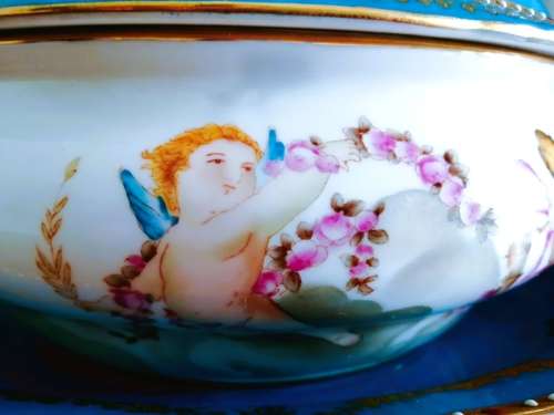 Sevres-style two-handled tureen and stand decorated with cherubs