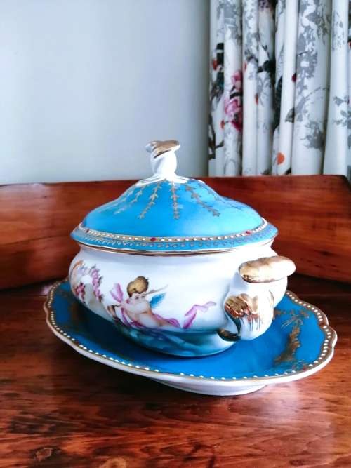 Sevres-style two-handled tureen and stand decorated with cherubs