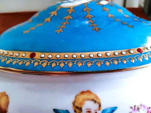 Sevres-style two-handled tureen and stand decorated with cherubs