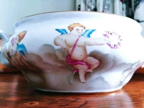 Sevres-style two-handled tureen and stand decorated with cherubs