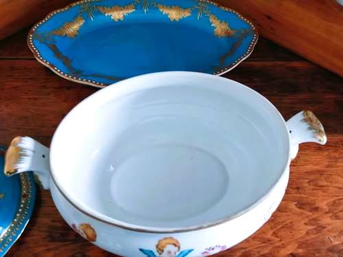 Sevres-style two-handled tureen and stand decorated with cherubs