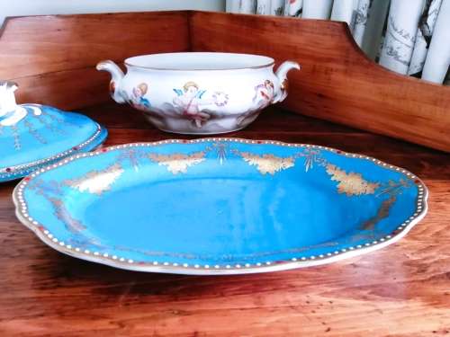 Sevres-style two-handled tureen and stand decorated with cherubs