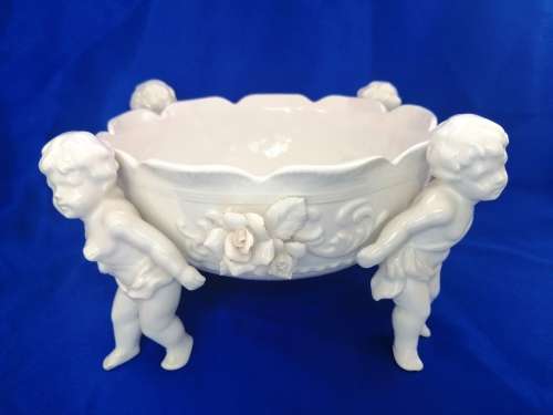 Beautiful White Italian Continental blanc de Chine center bowl depicting four putti Cherubs