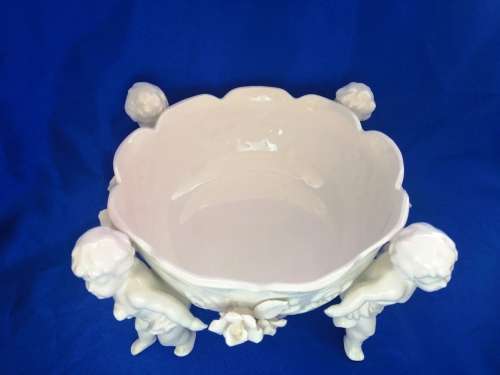 Beautiful White Italian Continental blanc de Chine center bowl depicting four putti Cherubs