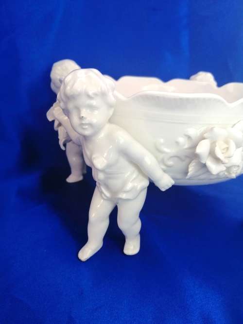 Beautiful White Italian Continental blanc de Chine center bowl depicting four putti Cherubs