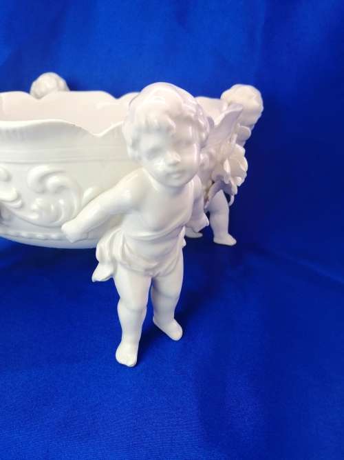 Beautiful White Italian Continental blanc de Chine center bowl depicting four putti Cherubs