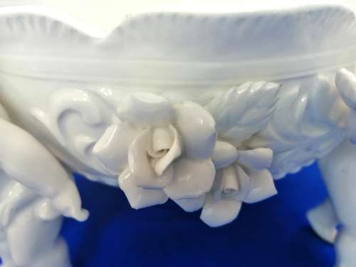 Beautiful White Italian Continental blanc de Chine center bowl depicting four putti Cherubs