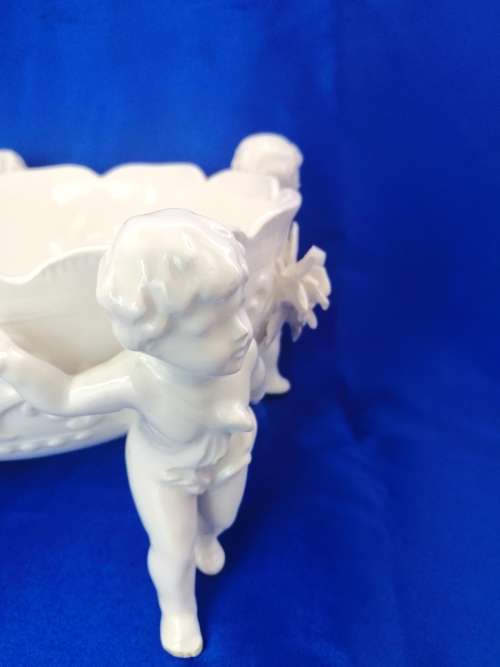 Beautiful White Italian Continental blanc de Chine center bowl depicting four putti Cherubs