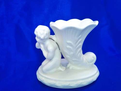 Staffordshire Heirloom Cherub Figurine Next to Vase