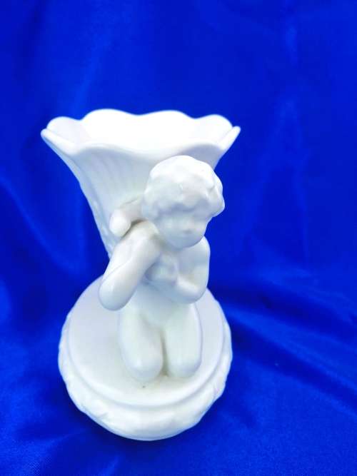 Staffordshire Heirloom Cherub Figurine Next to Vase