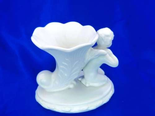 Staffordshire Heirloom Cherub Figurine Next to Vase
