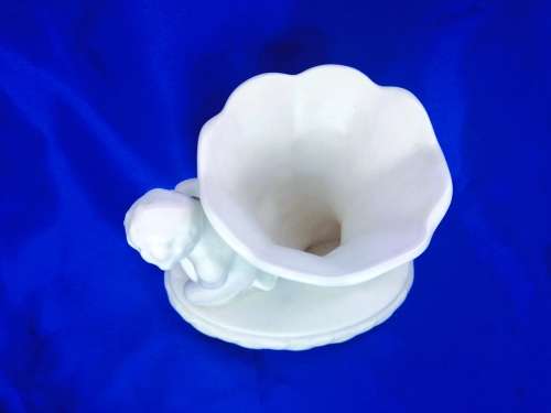 Staffordshire Heirloom Cherub Figurine Next to Vase