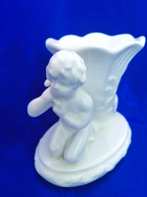 Staffordshire Heirloom Cherub Figurine Next to Vase