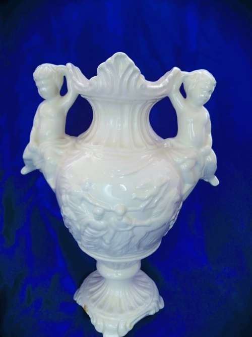 Faiarte blanc de china two-handled vase depicting cherubs angels