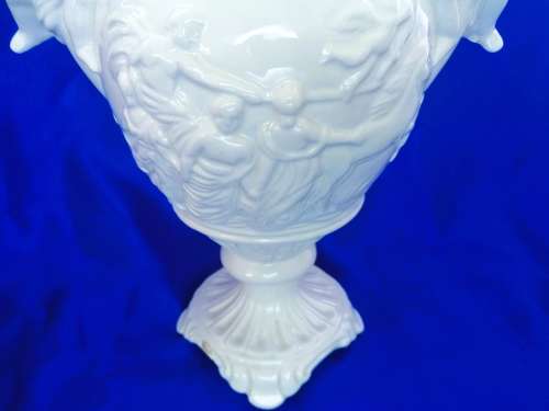 Faiarte blanc de china two-handled vase depicting cherubs angels