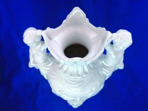 Faiarte blanc de china two-handled vase depicting cherubs angels