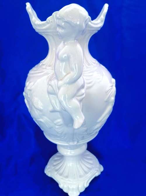 Faiarte blanc de china two-handled vase depicting cherubs angels