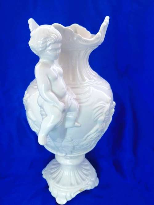 Faiarte blanc de china two-handled vase depicting cherubs angels