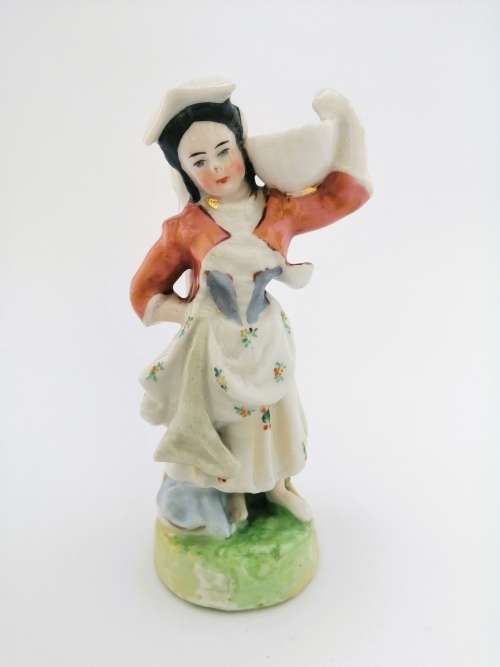 Continental figurine of a country maiden