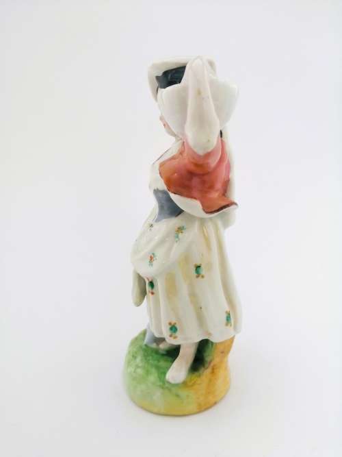 Continental figurine of a country maiden