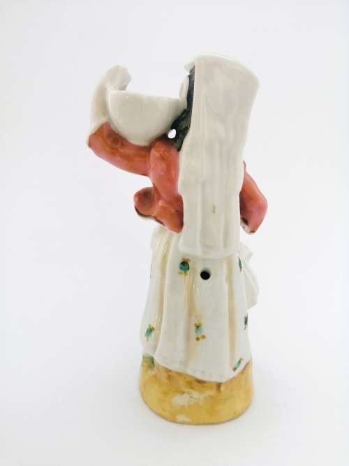 Continental figurine of a country maiden