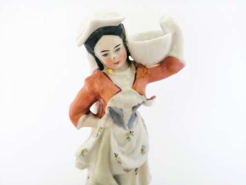 Continental figurine of a country maiden