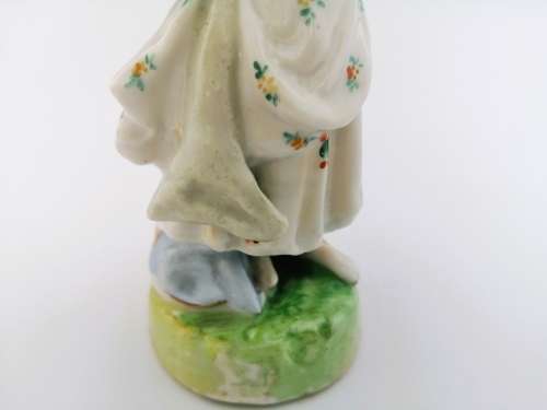 Continental figurine of a country maiden