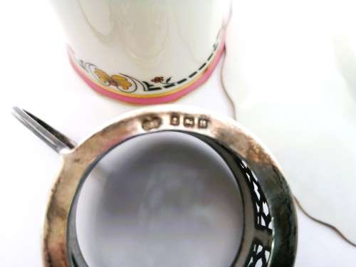 Aynsley coffee cup and saucer with silver holder, Birmingham, Deakin and Francis Ltd, 1926, 26g