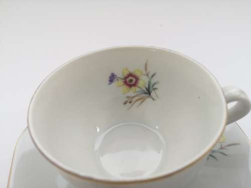 Pretty Demitasse cup and saucer White with flower design and gold trim