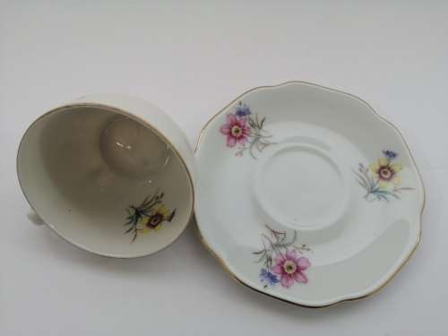 Pretty Demitasse cup and saucer White with flower design and gold trim