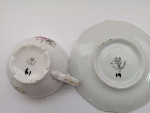 Pretty Demitasse cup and saucer White with flower design and gold trim