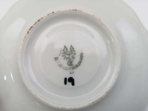 Pretty Demitasse cup and saucer White with flower design and gold trim