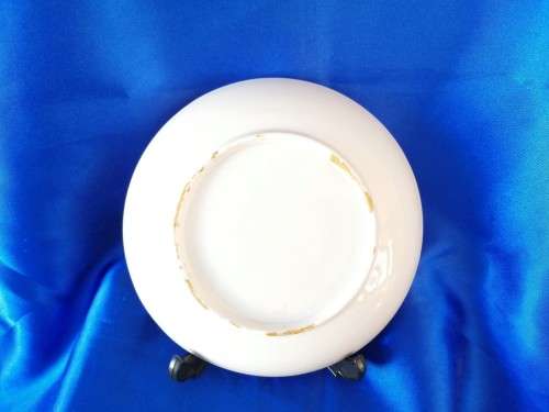 Five mixed china saucers plates and bowls