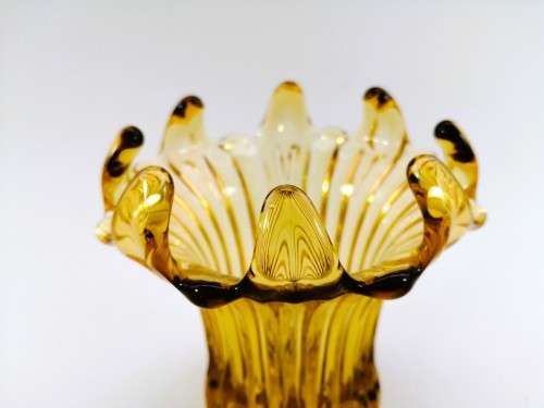 Amber glass vase has a unusual shape