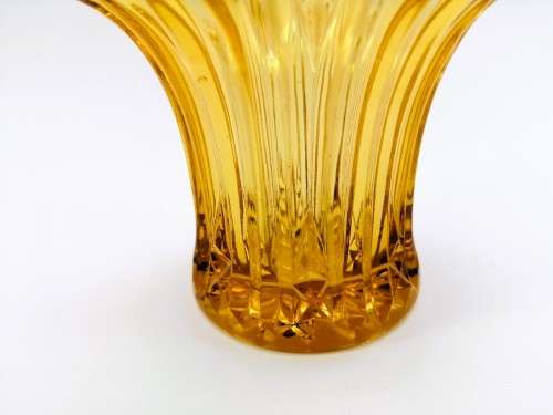 Amber glass vase has a unusual shape
