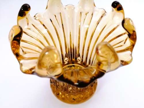 Amber glass vase has a unusual shape