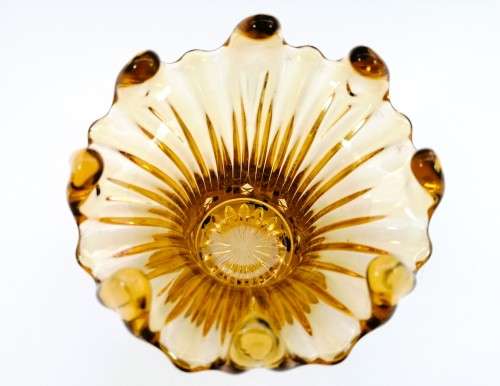 Amber glass vase has a unusual shape