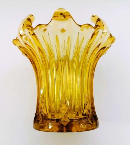 Amber glass vase has a unusual shape