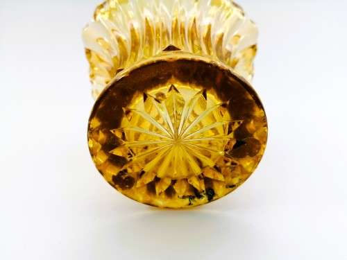Amber glass vase has a unusual shape