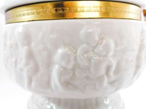 Continental blanc de Chine gilt metal mounted bowl depicting putti Cherubs