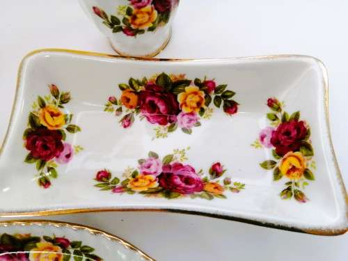 Fine Bone China Cottage Rose set of 4 items with gold trim.