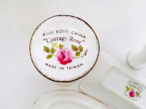 Fine Bone China Cottage Rose set of 4 items with gold trim.