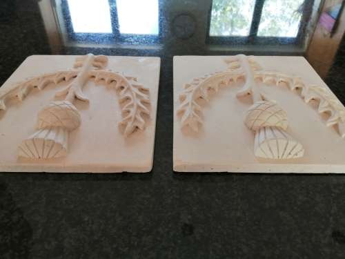 Pair of plaster-of-paris Thistle plaques