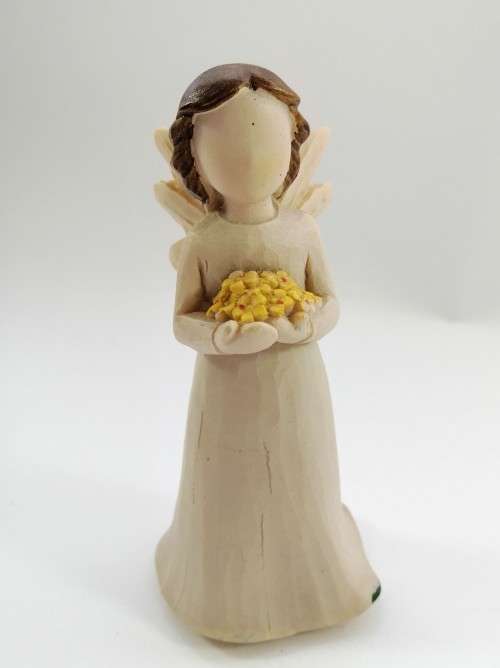 Willow Tree style wooden angel holding yellow flowers