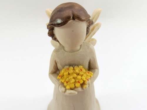 Willow Tree style wooden angel holding yellow flowers