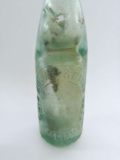 Three antique glass bottles