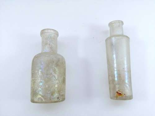 Three antique glass bottles