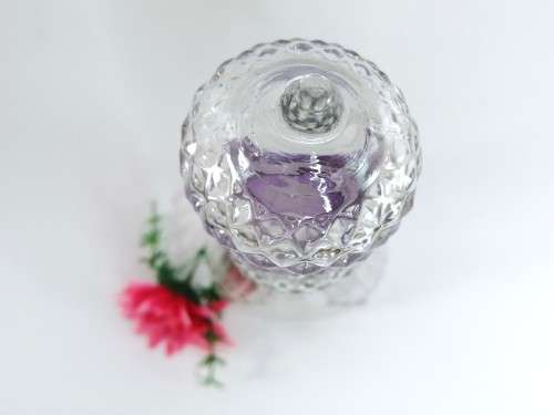 PROHIBITION ERA (1935-1964) CLEAR CUT GLASS GENIE DECANTER WITH PURPLE RING NECK